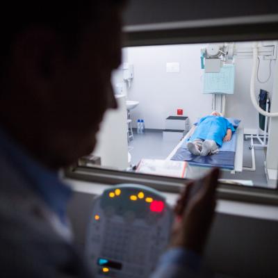Doctor Using X Ray Unit Control Panel Patient